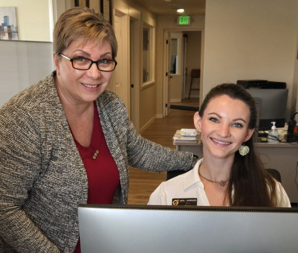 Office workers smiling at the camera